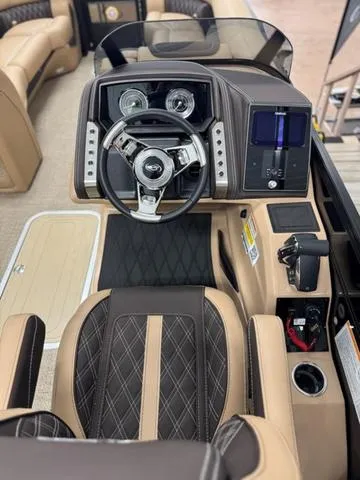 Slide: The Image of 2025 Barletta Lusso L25UC boat interior with luxurious steering console and seating. - 13