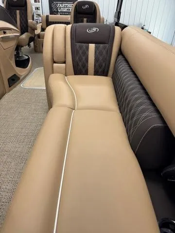 Slide: The Image of Luxurious seating in 2025 Barletta Lusso L25UC boat, featuring tan and black upholstery. - 8