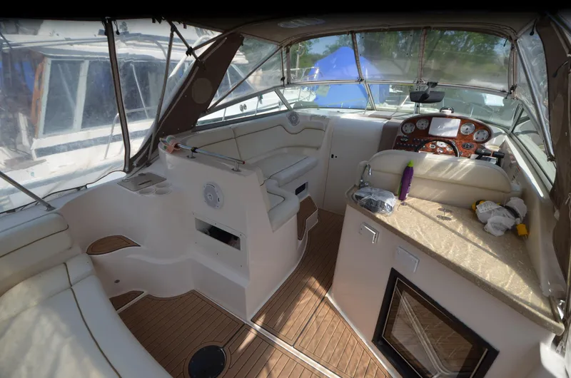 Slide: The Image of 2005 Rinker Fiesta Vee 300 EC boat interior with seating and control panel. - 7