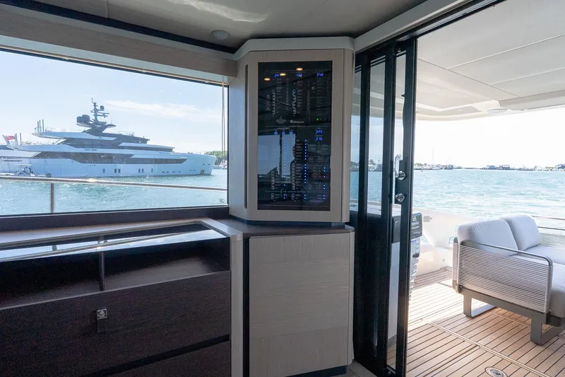 Slide: The Image of Interior view of 2026 Absolute Navetta 53 yacht with ocean backdrop. - 15