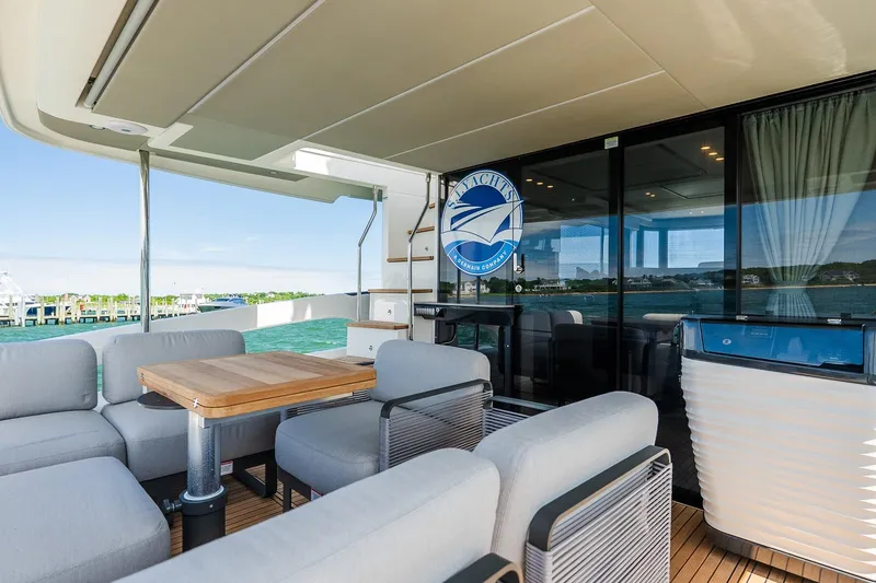 Slide: The Image of Luxurious outdoor seating on 2026 Absolute Navetta 53 yacht with ocean view. - 8