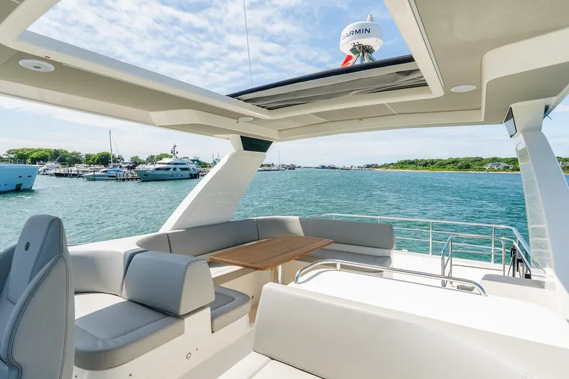 Slide: The Image of Luxurious 2026 Absolute Navetta 53 yacht interior with ocean view and modern seating. - 46