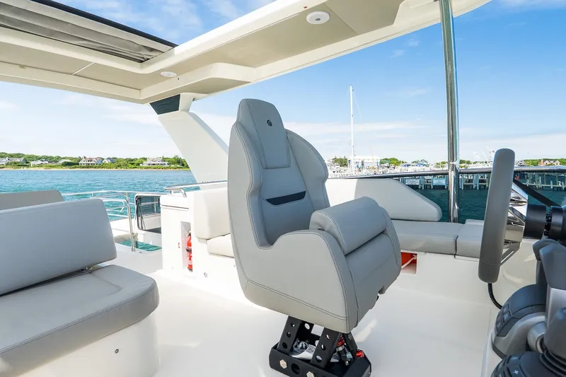 Slide: The Image of Luxurious helm of 2026 Absolute Navetta 53 yacht with scenic ocean view. - 54