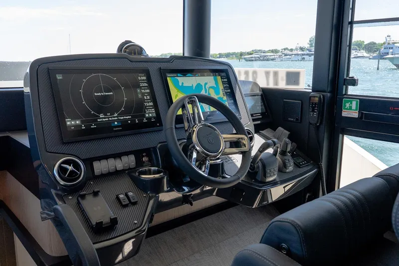 Slide: The Image of Cockpit of 2026 Absolute Navetta 53 yacht with advanced navigation systems and controls. - 24