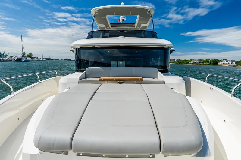 Slide: The Image of Luxury Absolute Navetta 53 yacht, 2026 model, cruising on a sunny day with clear skies. - 58