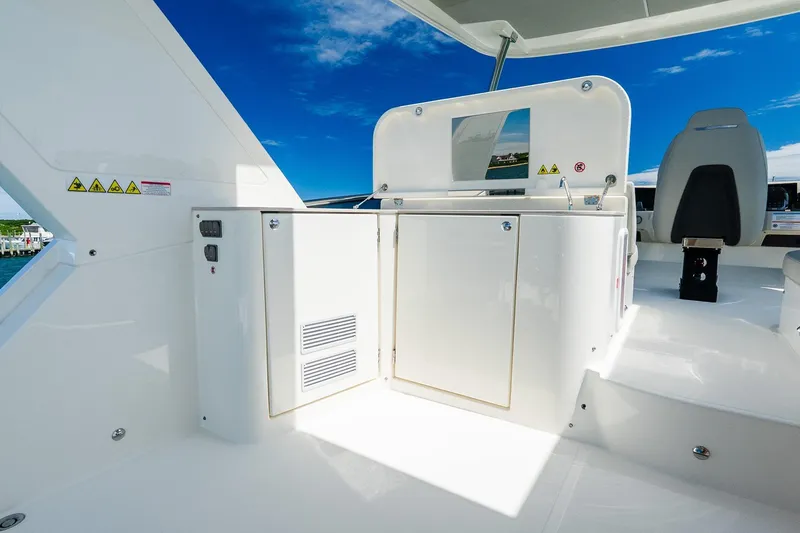 Slide: The Image of 2026 Absolute Navetta 53 yacht interior with sleek white cabinetry and modern design. - 48