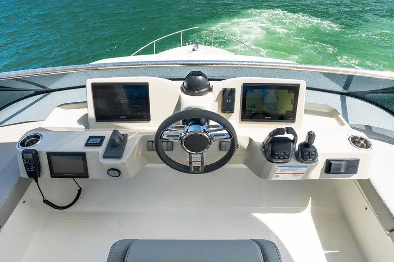 Slide: The Image of Cockpit of 2026 Absolute Navetta 53 yacht with advanced navigation systems and controls. - 55