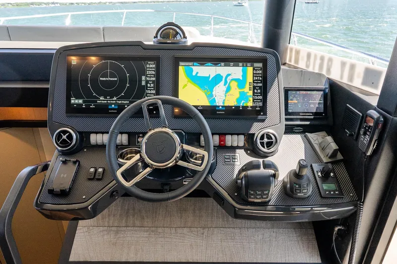 Slide: The Image of Helm of 2026 Absolute Navetta 53 yacht with advanced navigation displays and controls. - 25