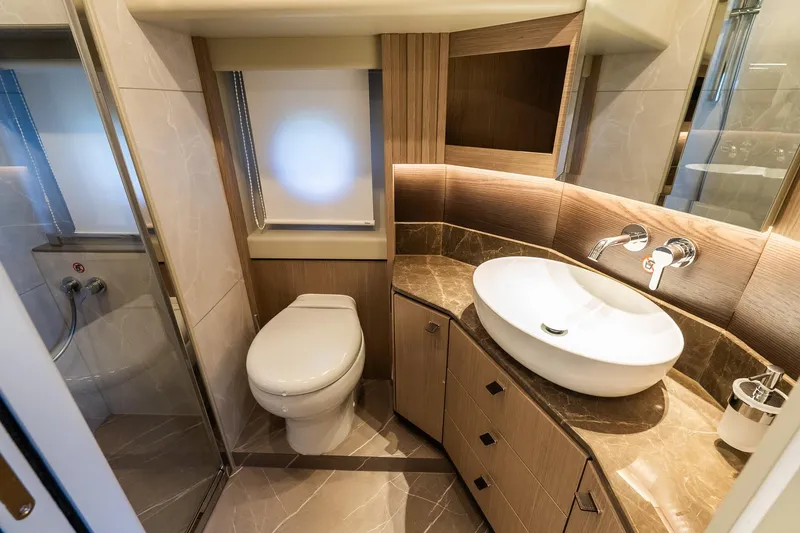 Slide: The Image of Luxurious bathroom in 2026 Absolute Navetta 53 yacht with modern fixtures and elegant design. - 30