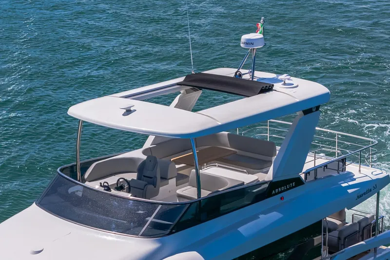 Slide: The Image of Luxury Absolute Navetta 53 yacht cruising on open water, 2026 model. - 5