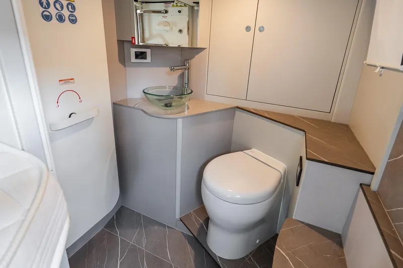 Slide: The Image of Modern bathroom in 2026 Absolute Navetta 53 yacht with sleek design and glass sink. - 39