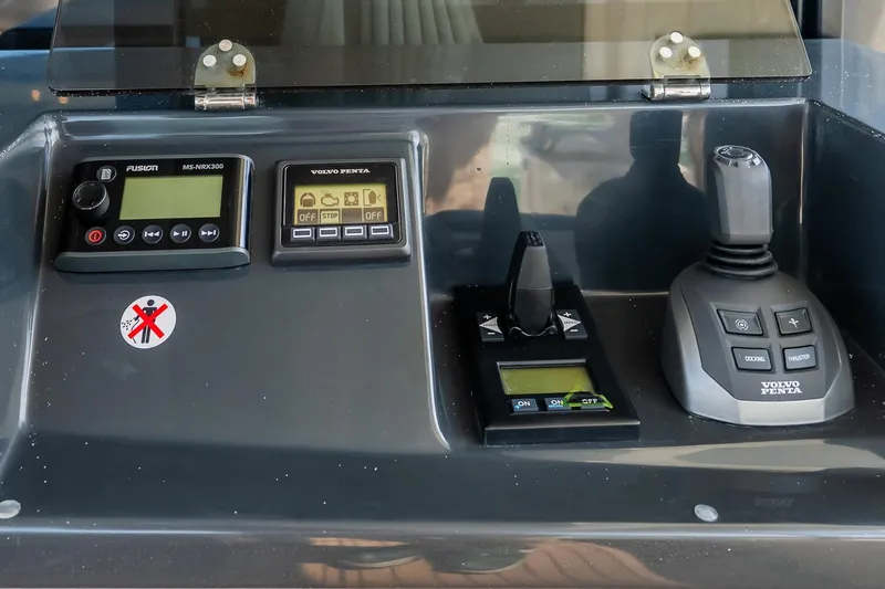 Slide: The Image of Control panel of 2026 Absolute Navetta 53 yacht with Volvo Penta joystick and displays. - 10