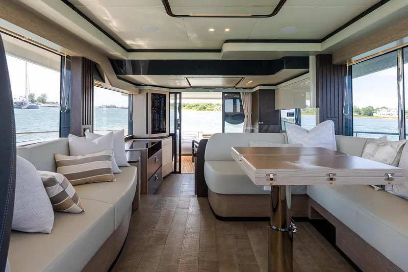 Slide: The Image of Luxurious interior of 2026 Absolute Navetta 53 yacht with elegant seating and scenic views. - 18