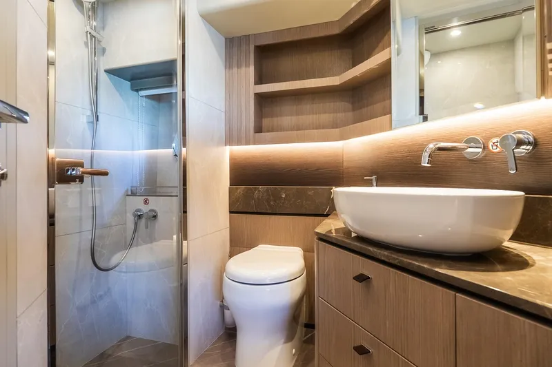 Slide: The Image of Luxurious bathroom in 2026 Absolute Navetta 53 yacht, featuring modern fixtures and elegant design. - 29