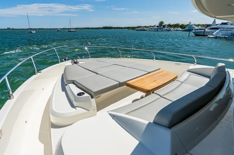 Slide: The Image of Luxurious 2026 Absolute Navetta 53 yacht with spacious deck seating and ocean view. - 56