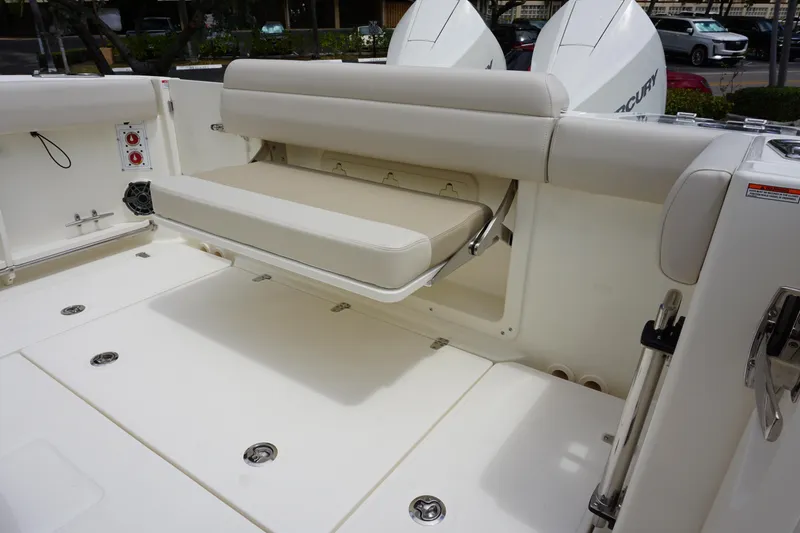Slide: The Image of 2025 Boston Whaler 280 Outrage boat with foldable seating and dual Mercury engines. - 14