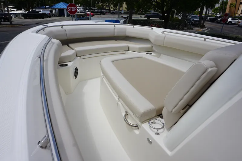 Slide: The Image of 2025 Boston Whaler 280 Outrage boat interior with cushioned seating and spacious layout. - 29