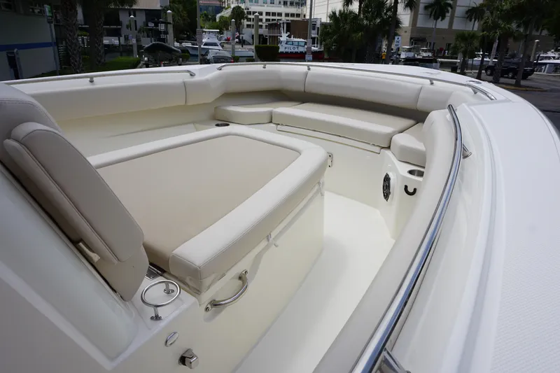 Slide: The Image of 2025 Boston Whaler 280 Outrage boat interior with cushioned seating and sleek design. - 30