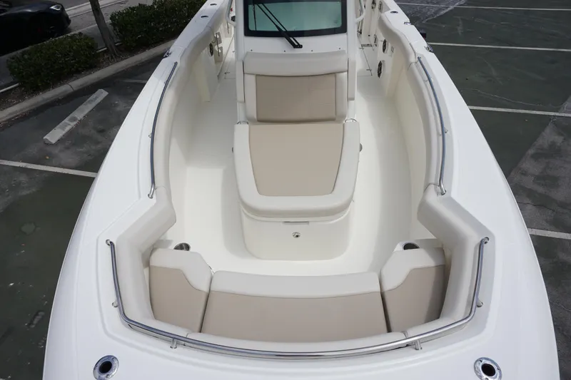 Slide: The Image of 2025 Boston Whaler 280 Outrage boat with spacious seating and sleek design. - 32