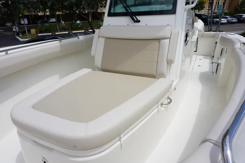 Slide: The Image of 2025 Boston Whaler 280 Outrage boat with cushioned seating in a sleek, modern design. - 34