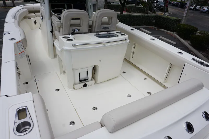 Slide: The Image of 2025 Boston Whaler 280 Outrage boat interior with seating and storage compartments. - 7