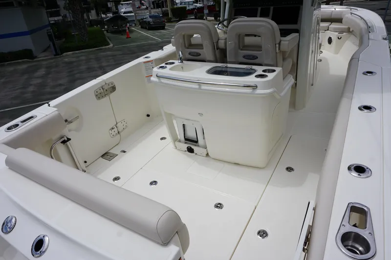 Slide: The Image of 2025 Boston Whaler 280 Outrage boat interior with seating and fishing amenities. - 8