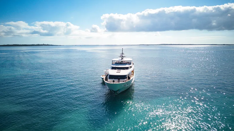 Slide: The Image of Luxurious 2012 Sanlorenzo SD92 yacht cruising on serene blue waters under a clear sky. - 10