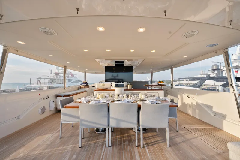 Slide: The Image of Luxurious dining area on 2012 Sanlorenzo SD92 yacht, featuring elegant table setting and modern design. - 15