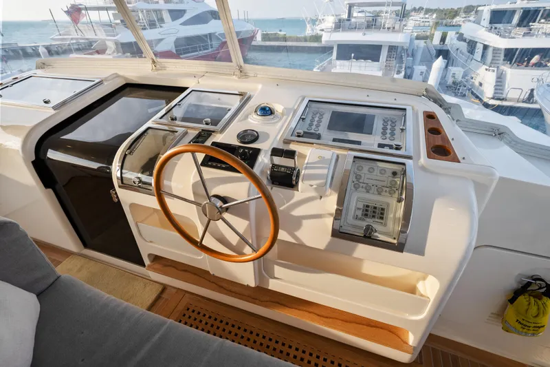 Slide: The Image of Helm of 2012 Sanlorenzo SD92 yacht with modern navigation equipment and wooden steering wheel. - 22