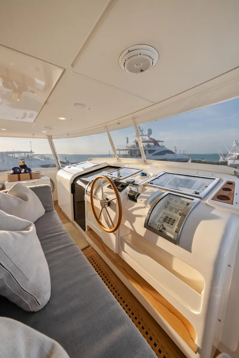Slide: The Image of Interior view of 2012 Sanlorenzo SD92 yacht helm with modern controls and ocean view. - 23