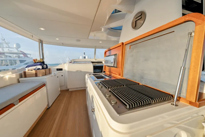 Slide: The Image of Luxurious Sanlorenzo SD92 yacht interior with modern kitchen, wooden flooring, and ocean view. - 27