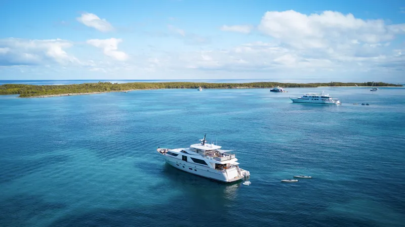 Slide: The Image of Sanlorenzo SD92 yacht from 2012 cruising in clear blue waters under a sunny sky. - 3