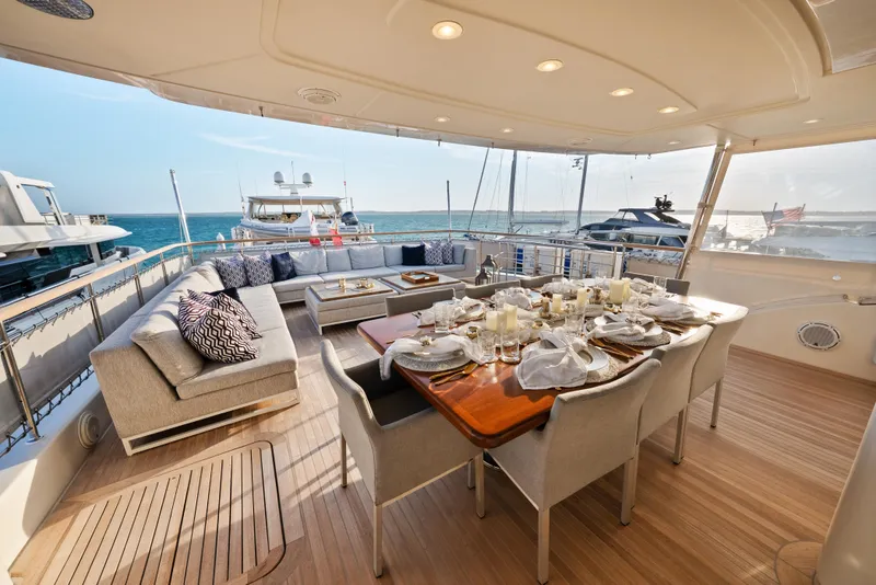 Slide: The Image of Luxurious 2012 Sanlorenzo SD92 yacht deck with elegant dining setup and ocean view. - 31