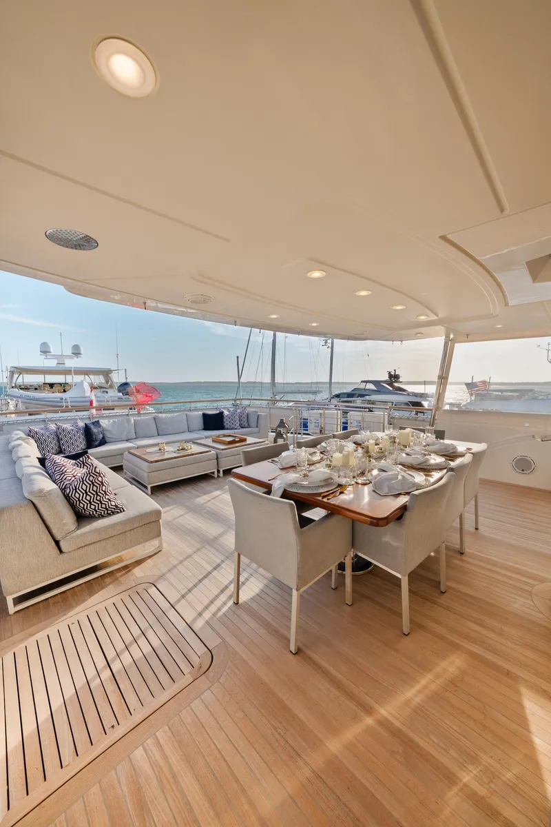 Slide: The Image of Luxurious 2012 Sanlorenzo SD92 yacht deck with elegant dining area and ocean view. - 32