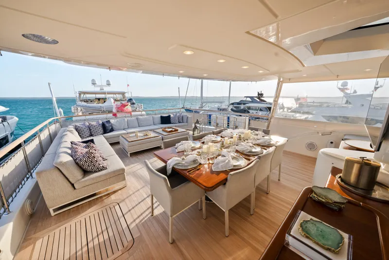 Slide: The Image of Luxurious 2012 Sanlorenzo SD92 yacht deck with elegant dining setup and ocean view. - 33