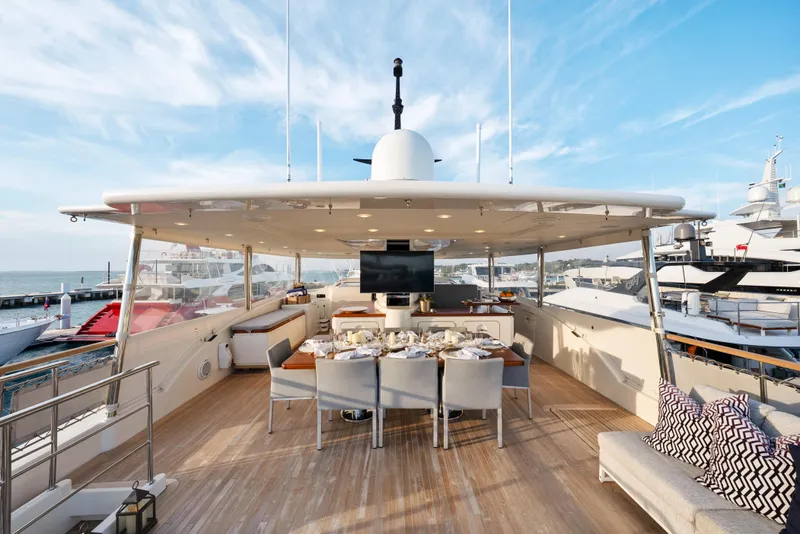 Slide: The Image of Luxurious 2012 Sanlorenzo SD92 yacht deck with elegant dining area and scenic marina view. - 42