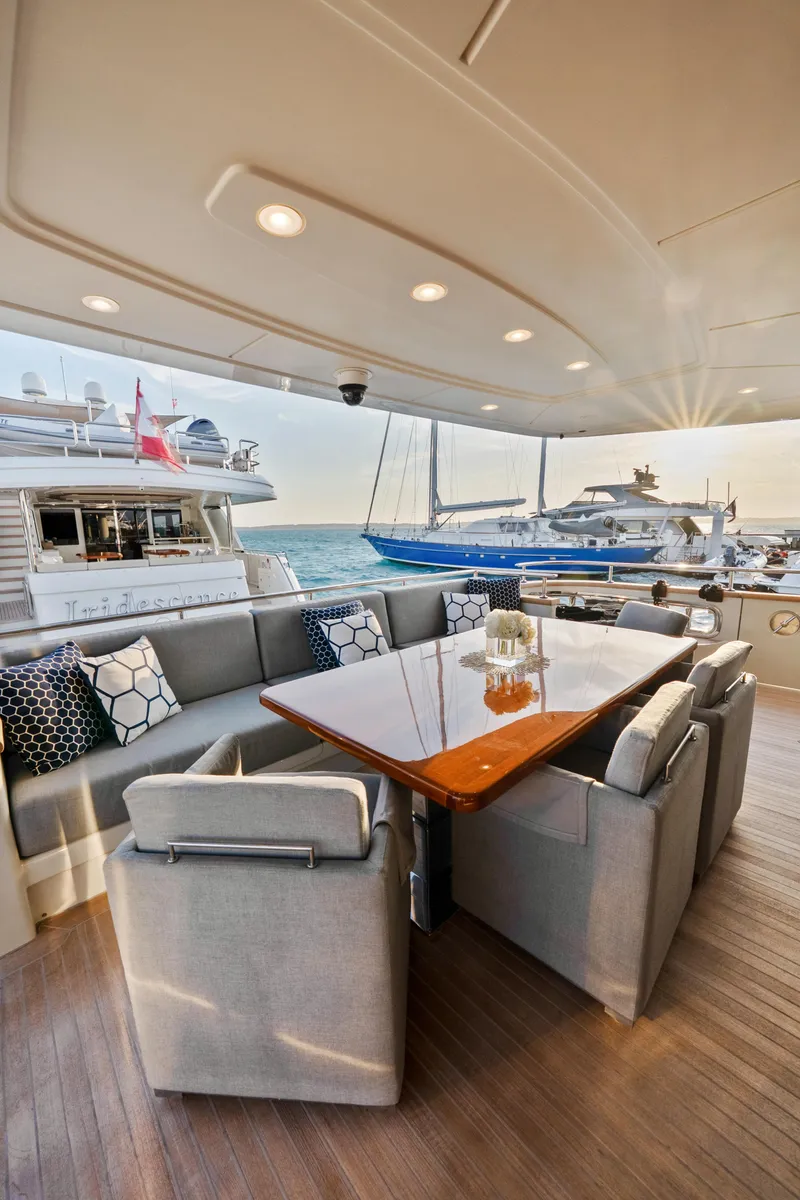 Slide: The Image of Luxurious 2012 Sanlorenzo SD92 yacht deck with elegant seating and dining area. - 48