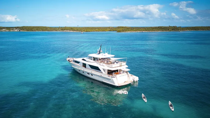 Slide: The Image of Luxurious 2012 Sanlorenzo SD92 yacht anchored in clear blue waters. - 7