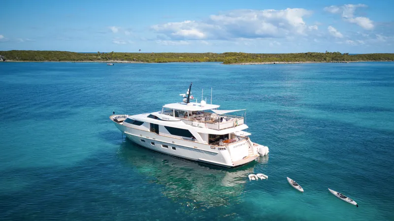 Slide: The Image of Sanlorenzo SD92 yacht from 2012 anchored in clear blue waters, surrounded by small boats. - 8