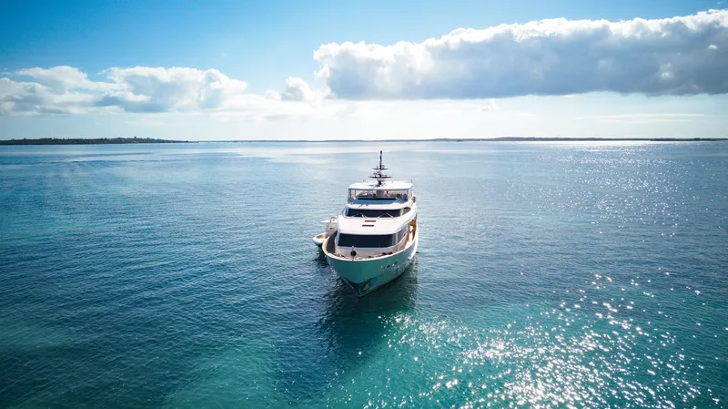 Slide: The Image of Sanlorenzo SD92 yacht from 2012 cruising on a serene, sunlit ocean. - 9