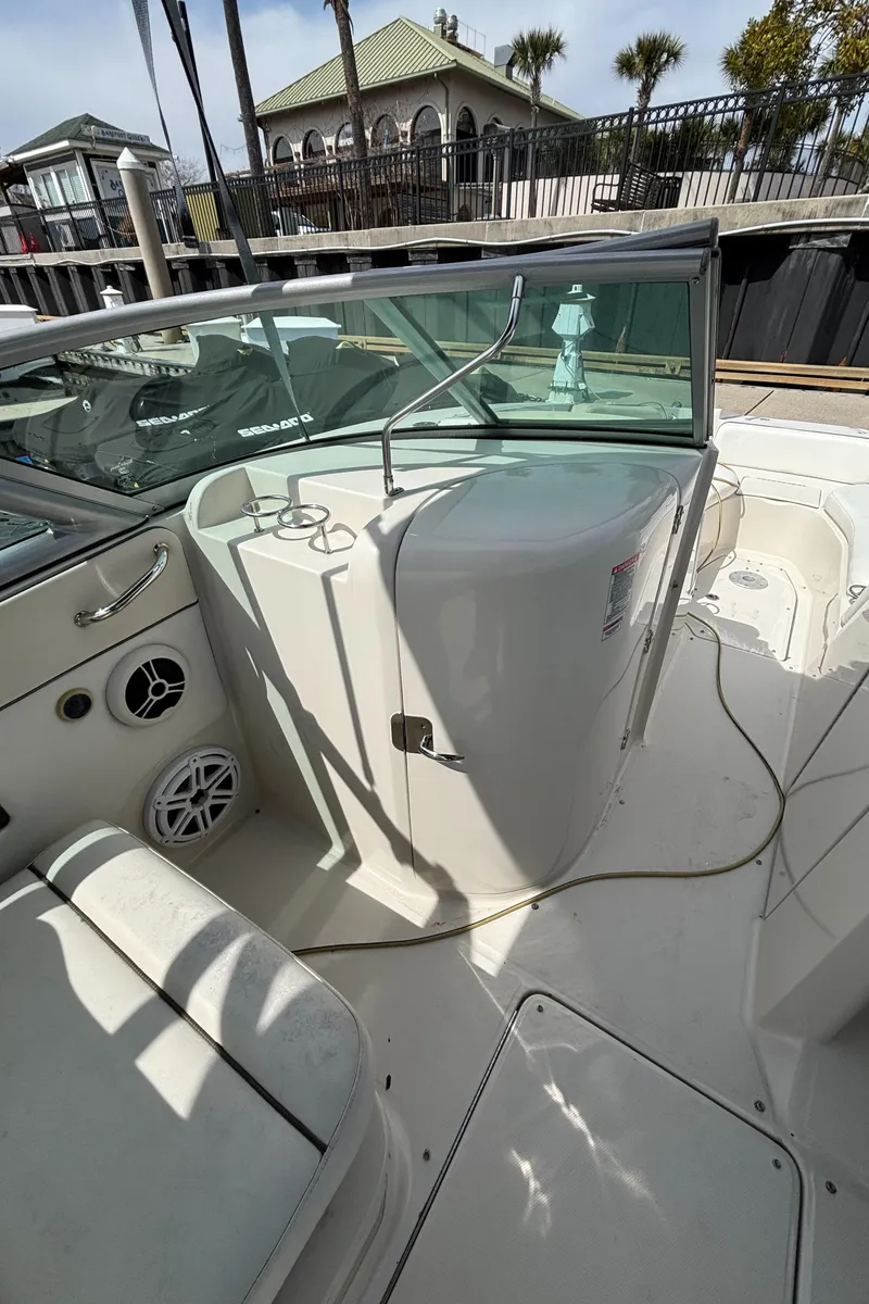 Slide: The Image of 2008 Sea Ray 290 Sundeck boat interior with seating and storage compartments. - 27