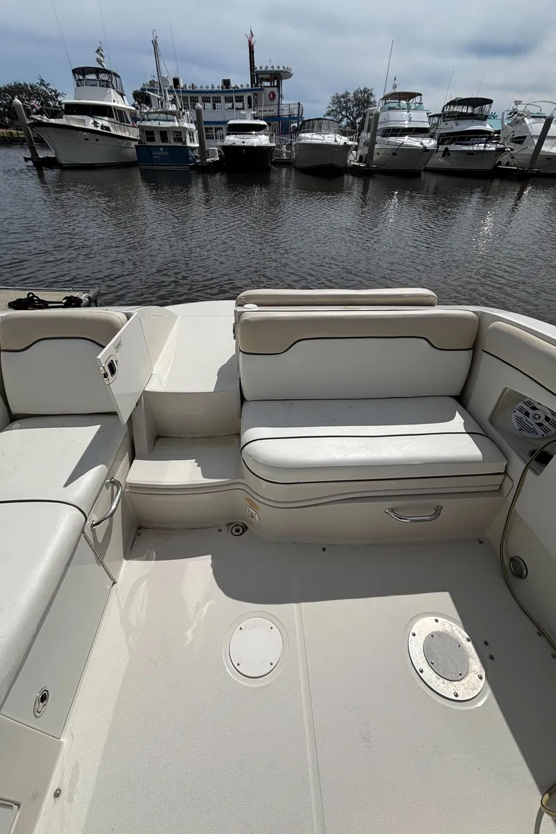 Slide: The Image of 2008 Sea Ray 290 Sundeck boat interior with marina view in the background. - 35