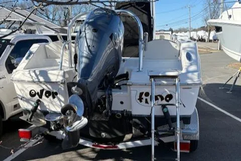 Slide: The Image of 2021 Robalo R200 Center Console boat with outboard motor and ladder. - 2