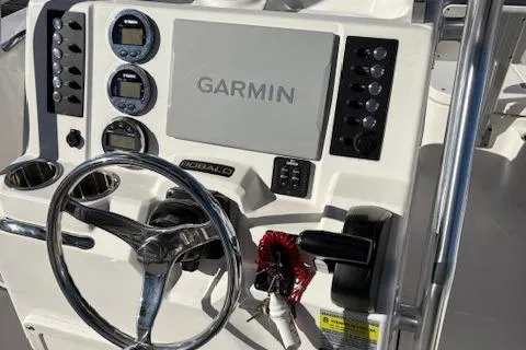 Slide: The Image of 2021 Robalo R200 Center Console dashboard with Garmin display and steering wheel. - 6