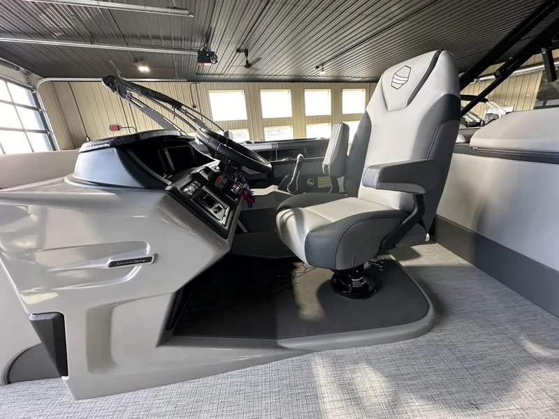 Slide: The Image of 2025 South Bay 523RS boat interior with modern helm and comfortable captain's chair. - 5
