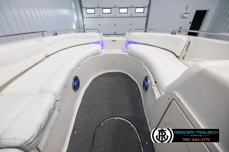 Slide: The Image of 2015 Starcraft 1915 Limited OB boat interior with white seating and blue accent lighting. - 15