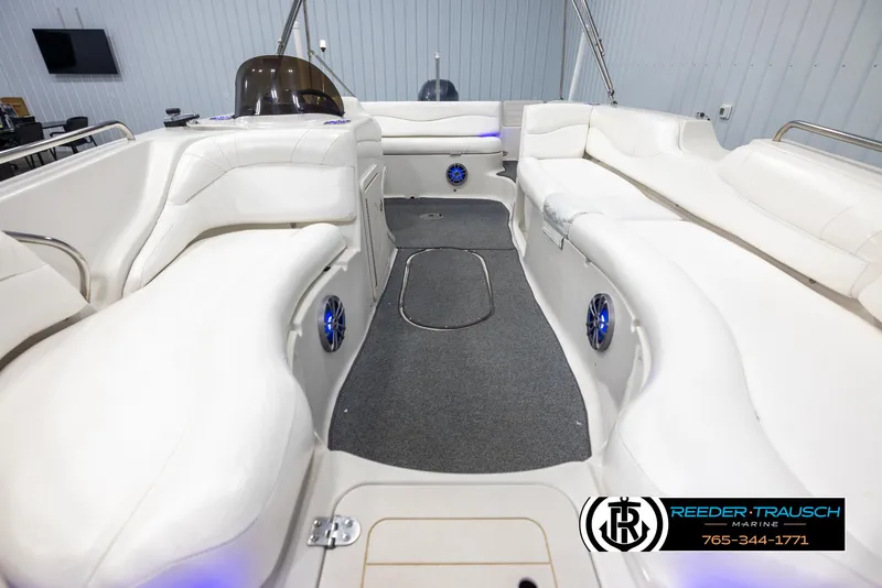 Slide: The Image of 2015 Starcraft 1915 Limited OB boat interior with white seating and carpeted floor. - 16