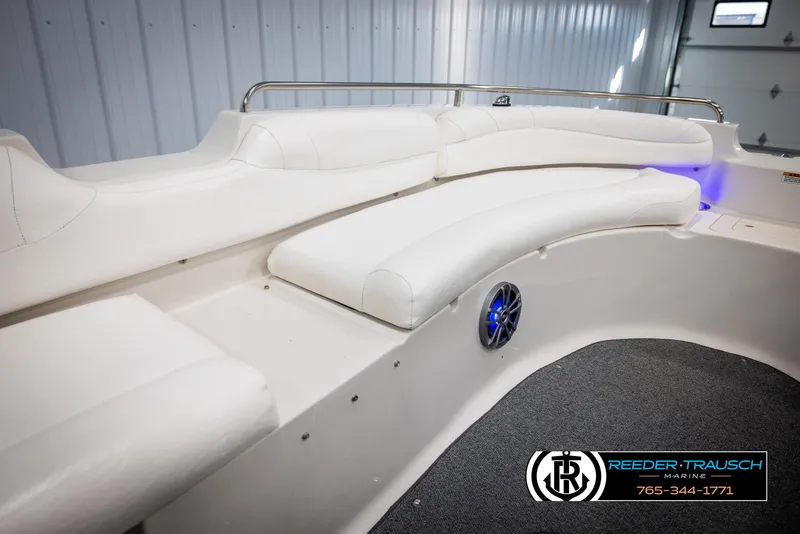 Slide: The Image of 2015 Starcraft 1915 Limited OB boat interior with white seating and speaker detail. - 20