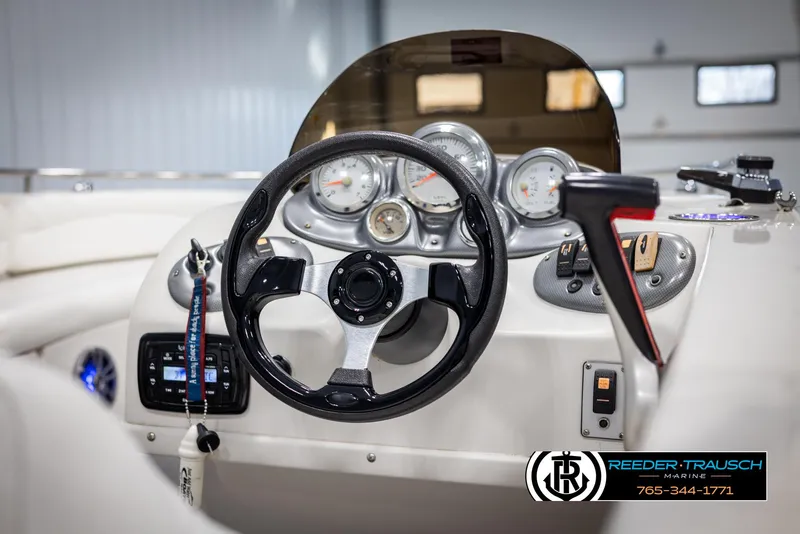Slide: The Image of Steering console of 2015 Starcraft 1915 Limited OB boat with gauges and controls. - 26