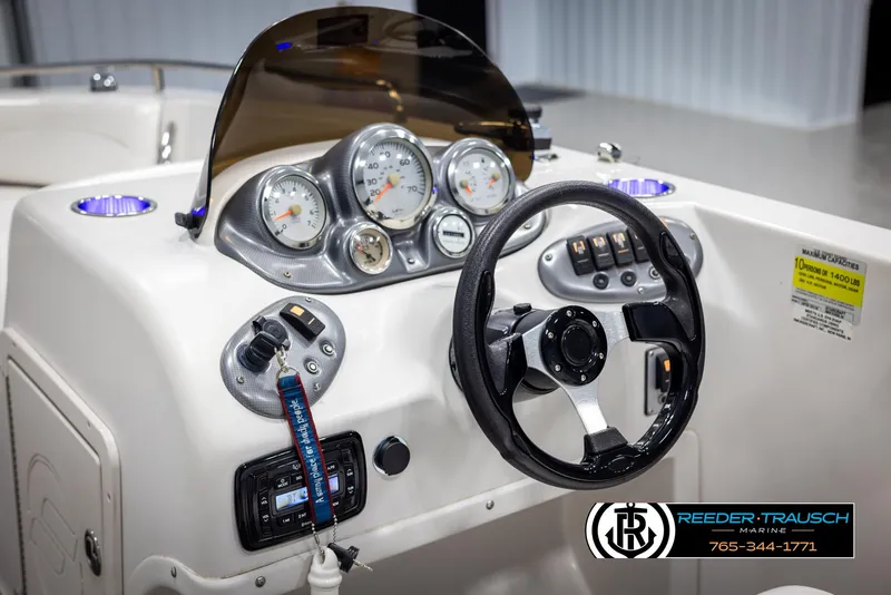 Slide: The Image of Dashboard of 2015 Starcraft 1915 Limited OB boat with steering wheel and gauges. - 27